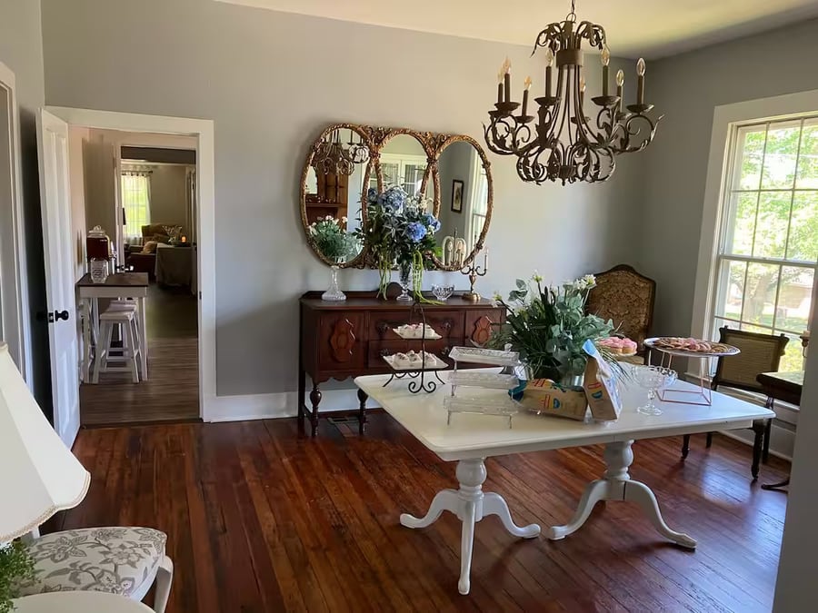 Dining room with chandelier and hardwood floors